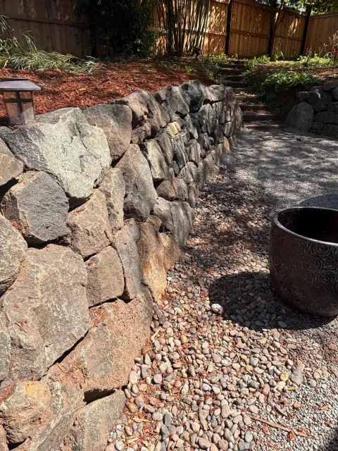 Dry stone retaining wall and landscaping detail, photo 4