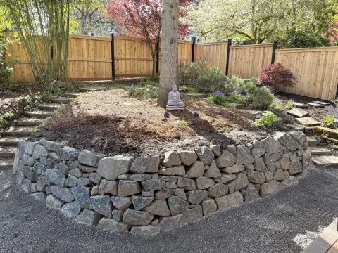 Dry stone retaining wall and landscaping detail, photo 1